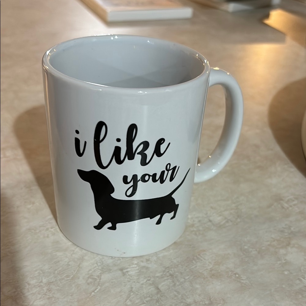 White Ceramic Mug with Black Dachshund Design. “I like your dachshund “